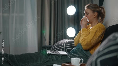 Sick woman is working from home.