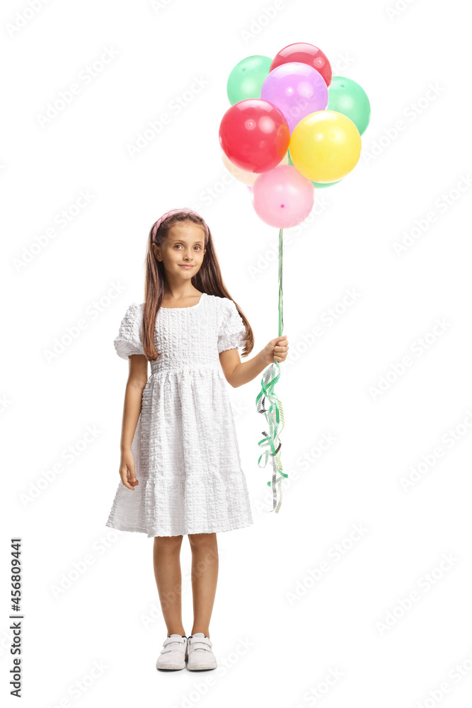 Full length portrait of a girl in a beautiful girl in a white dress holding a bunch of balloons Full length portrait of a girl in a beautiful girl in a white dress holding a bunch of balloons