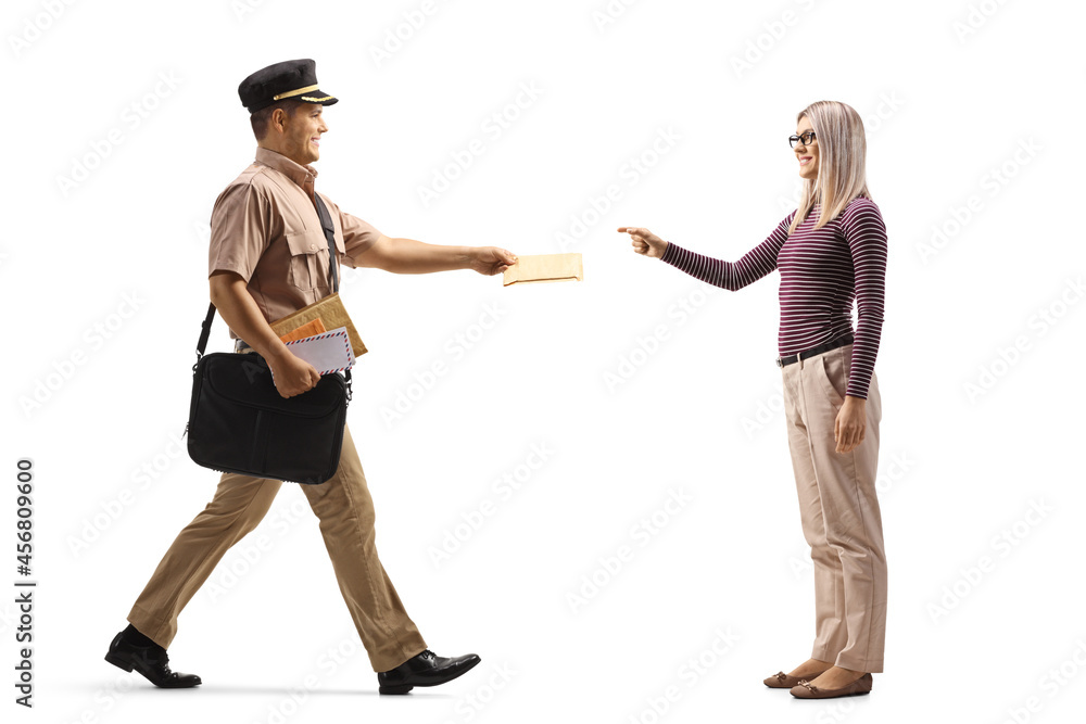 Full length profile shot of a mailman giving a letter to a young woman Full length profile shot of a mailman giving a letter to a young woman