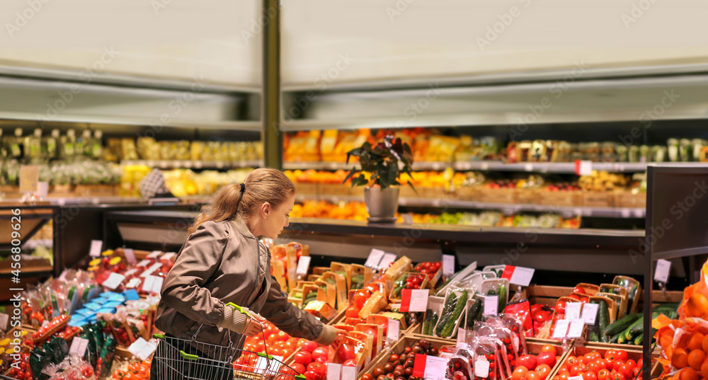 Woman buying vegetables at the market