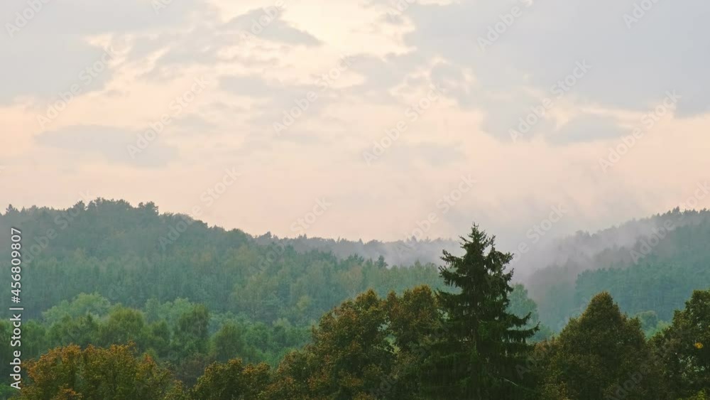 Rain Clouds and Fog Floating over Green Forest Hills in Poland Timelapse Rain Clouds and Fog Floating over Green Forest Hills in Poland Timelapse