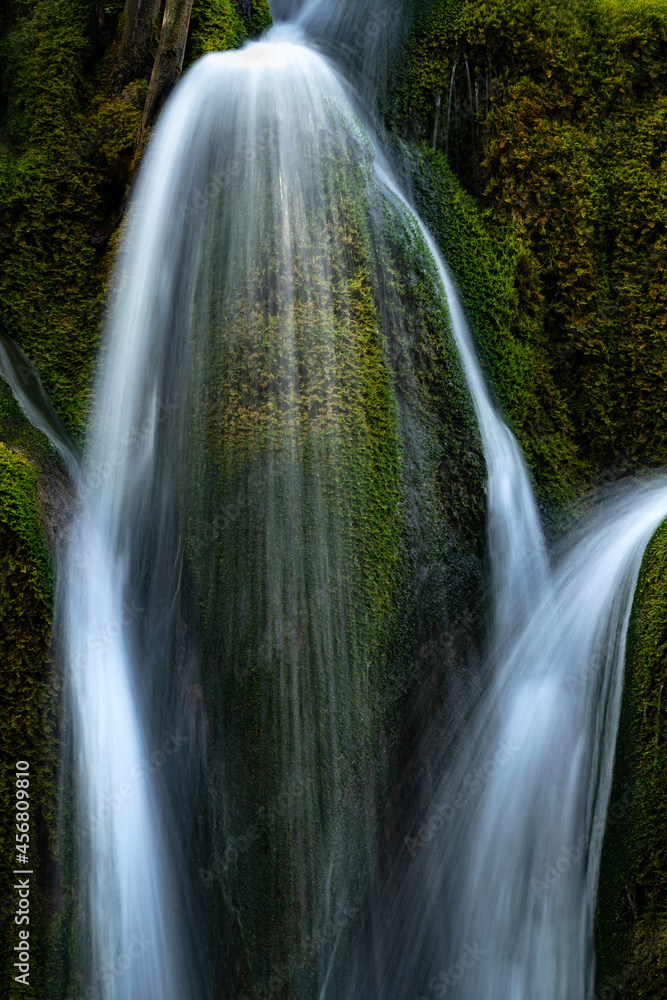 Detail of moss covered stones under the waterfall.