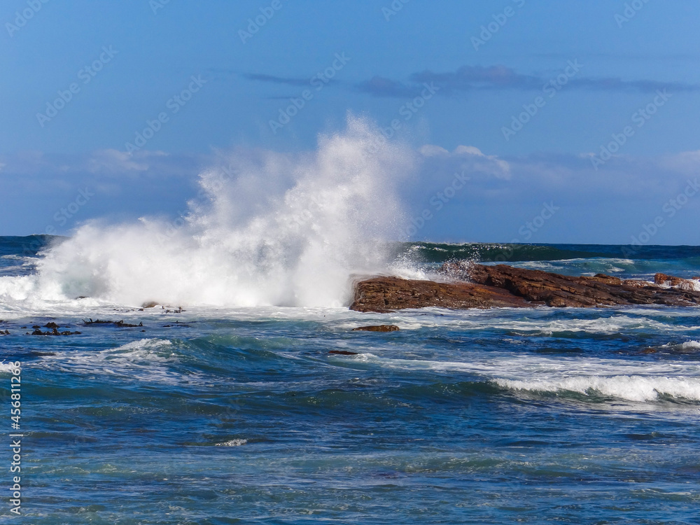 Waves crashing on rocks off the African coast