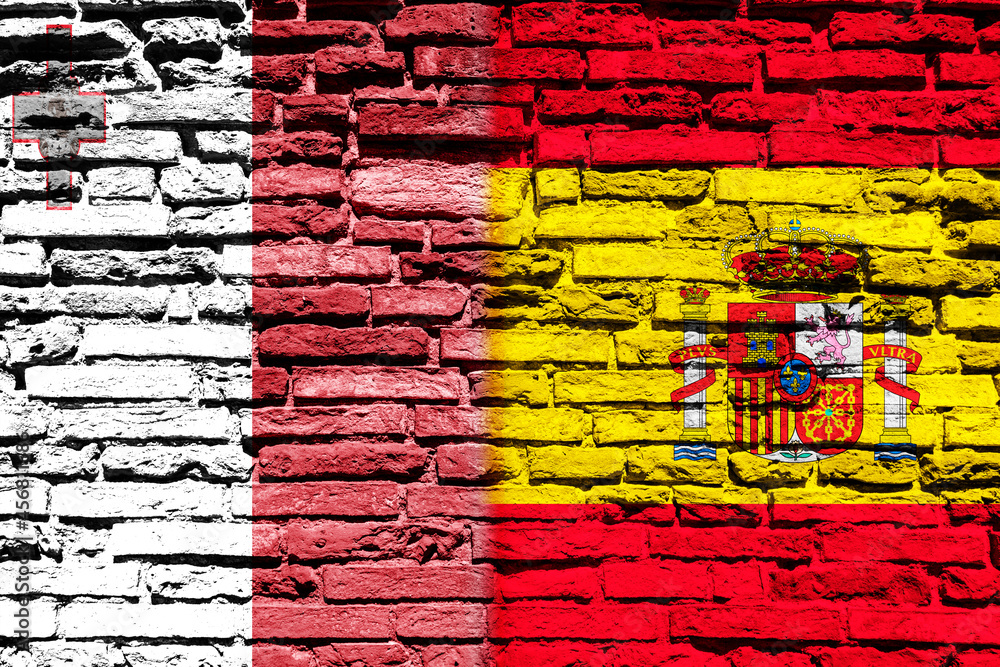 Background with flag of Malta and Spain on brick wall Background with flag of Malta and Spain on brick wall