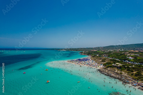 Aerial panoramic view of La Pelosa beach in Stintino, Sardinia with crystal clear turquoise water © Audrius