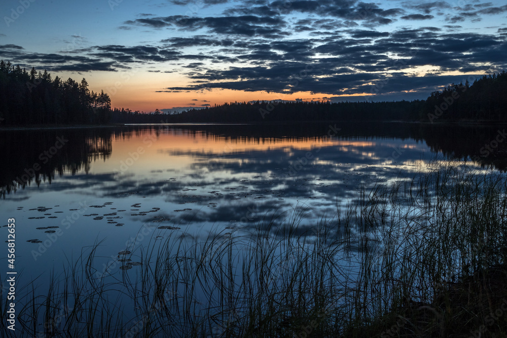 Evening over the lake. Dark blue sky. Night, forest, lake.