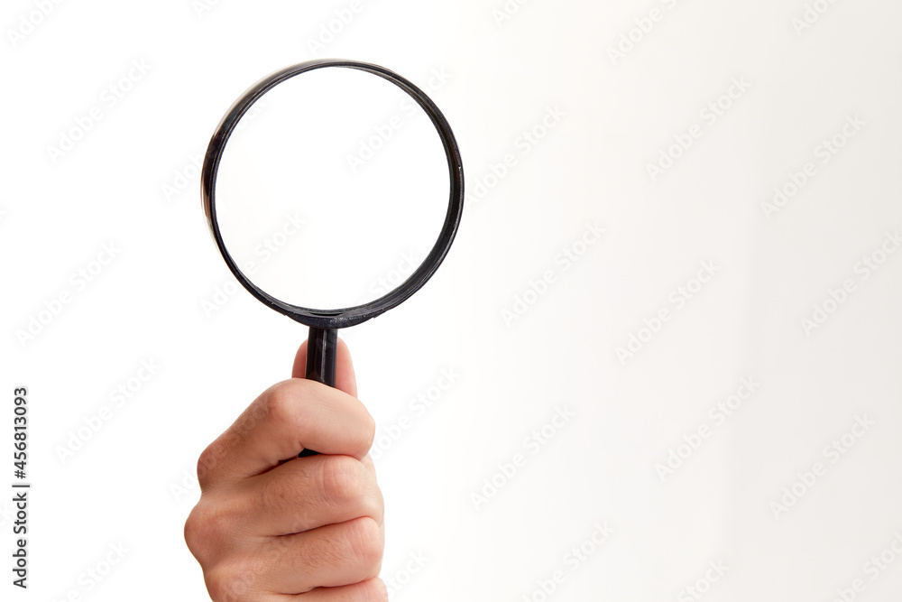 man holding magnifying glass on white background man holding magnifying glass on white background
