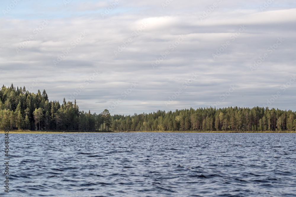 Northern nature. Panorama of the forest. Lake, forest, river. Beautiful landscape with lake and forest. Sunset and sunrise. Reflection of the forest in the water. Northern nature. Panorama of the forest. Lake, forest, river. Beautiful landscape with lake and forest. Sunset and sunrise. Reflection of the forest in the water.