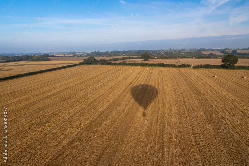 Obraz premium Aerial images of Wiltshire England taken from a hot air balloon. A cold and foggy morning flying over the recently harvested fields. 