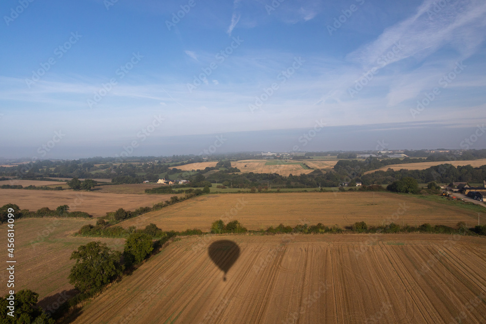 Obraz premium Aerial images of Wiltshire England taken from a hot air balloon. A cold and foggy morning flying over the recently harvested fields. 