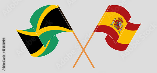 Crossed and waving flags of Jamaica and Spain