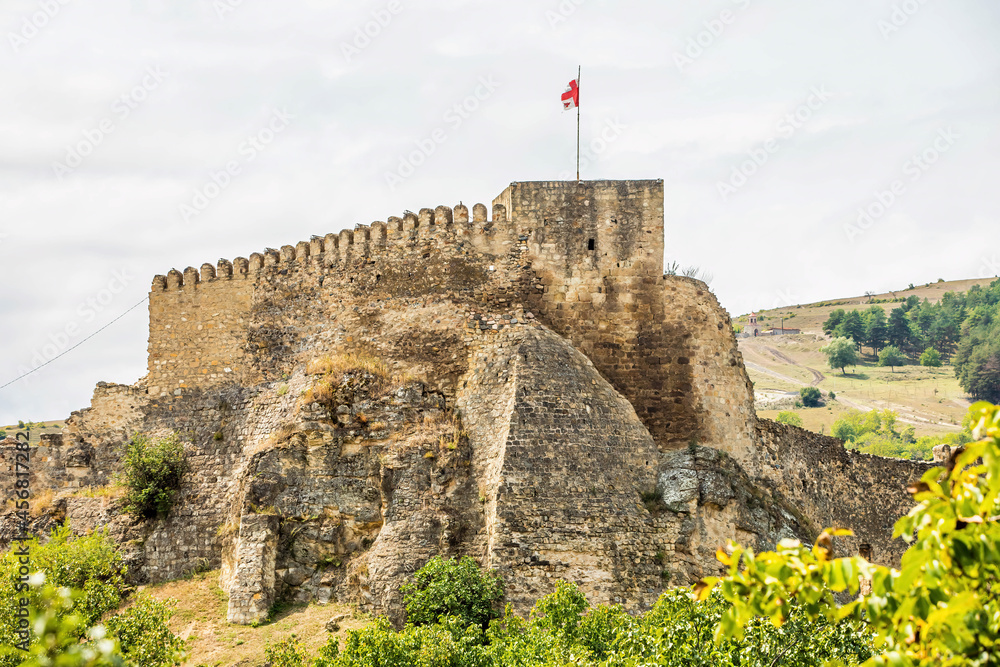 Close up view of Surami Fortress in Georgia with flag