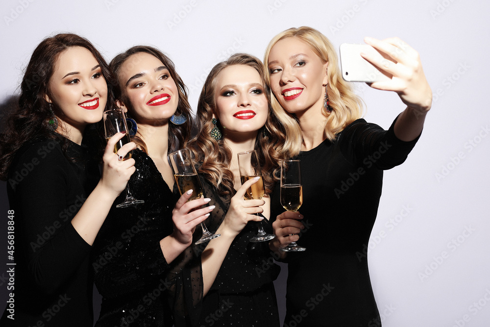 Close-up shot of group of laughing girls having party, take self