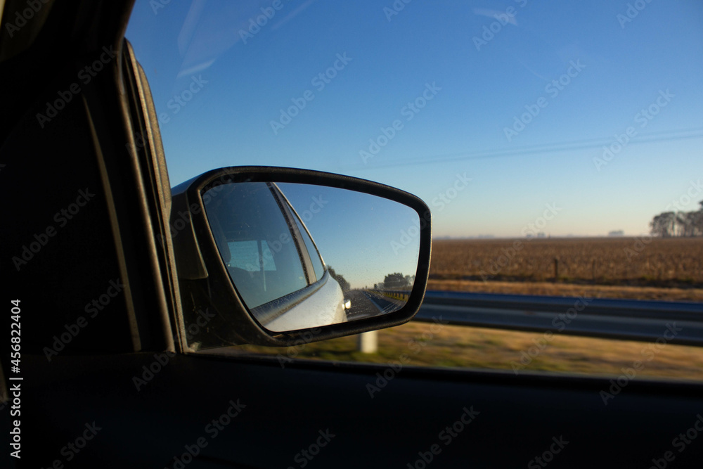 car rear view mirror moving on the road