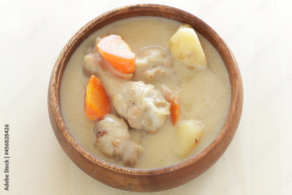 homemade chicken and potato clam stew in wooden bowl homemade chicken and potato clam stew in wooden bowl