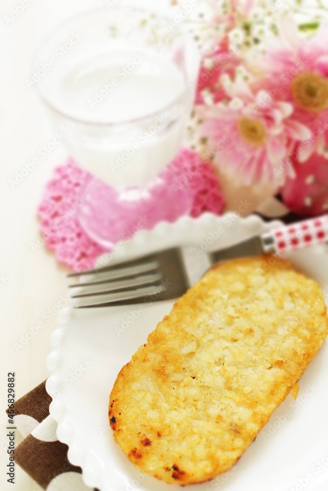 American breakfast, hashed brown on white dish with fork
American breakfast, hashed brown on white dish with fork