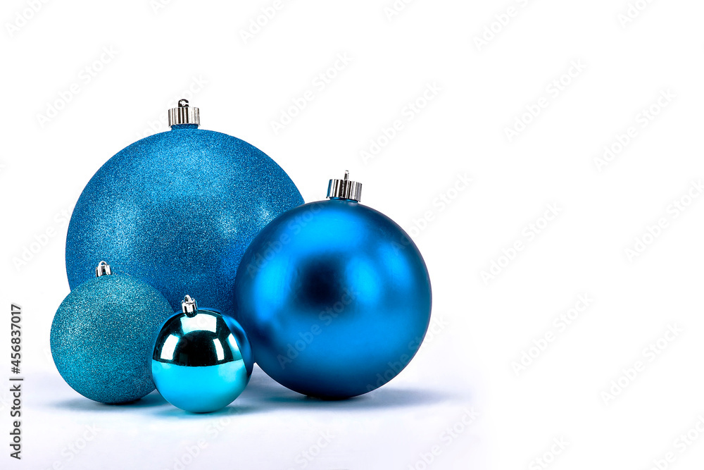 Christmas balls of blue color on white background with space for text, bauble to decorate the tree, christmas concept