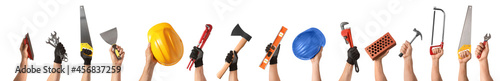 Human hands with construction supplies on white background photo