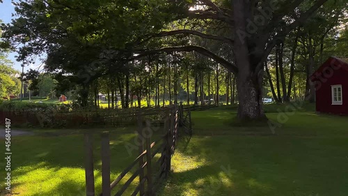 A beautiful park with a typical Swedish wooden fence at Knappfors, Lunedet Camping, Karlskoga - Sweden. photo