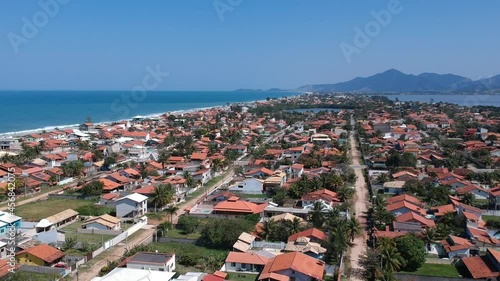 Aerial view of Saquarema and Itaúna beach in Rio de Janeiro. Famous for the waves and the church on top of the hill. Sunny day. Drone take. photo