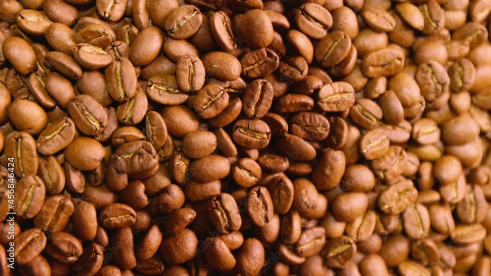 Roasting machine drum, spin around and move coffee beans for perfect roast. Coffee roasting process in small business company. Roasting machine drum, spin around and move coffee beans for perfect roast. Coffee roasting process in small business company.