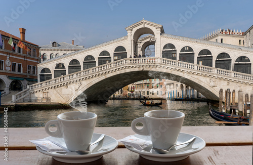 coffee for two in front of the Rialto bridge in Venice - steaming cups
