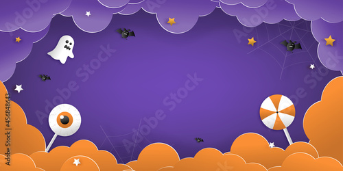 Happy Halloween greeting banner or party invitation with night clouds, pumpkins, bats, and cute ghosts, vampires on a violet background. Paper cut and papercraft style.Vector illustration.