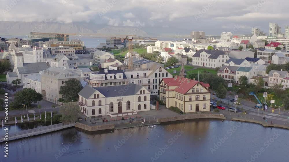 Traditional Iceland buildings on shore of lake Tjörnin, city center of Reykjavik Traditional Iceland buildings on shore of lake Tjörnin, city center of Reykjavik