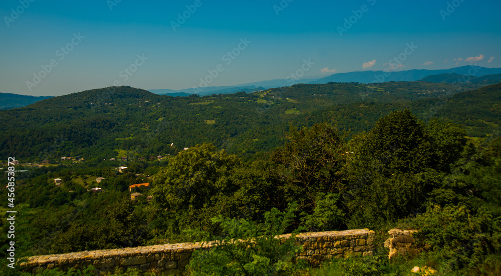 KUTAISI, GEORGIA: Beautiful landscape with views of the hills and mountains in Gelati Monastery on a sunny summer day.