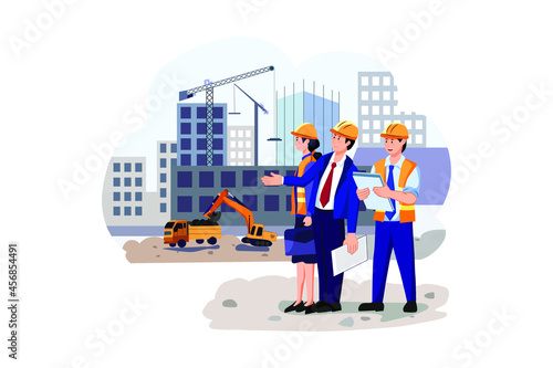 Real estate developer checking work of building