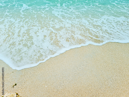 Soft blue waves on a clean sandy beach. travel photos