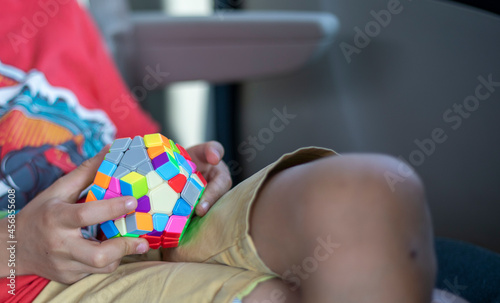 boy collect colorful puzzle in the car on the road, travel, family vacation