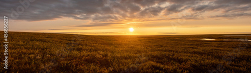 Natural sunrise. Landscape under a picturesque beautiful sky. The sun is over the horizon. Panorama.