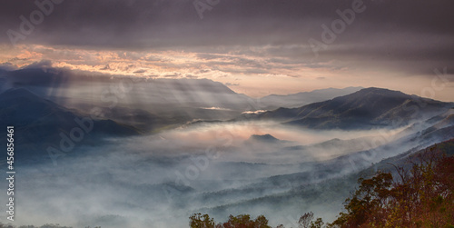 Sunrise Mist Fog and Rays over a Beautiful valley and mountains from high on a lookout 