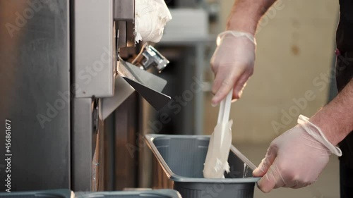 Male confectioner making ice cream at manufacture