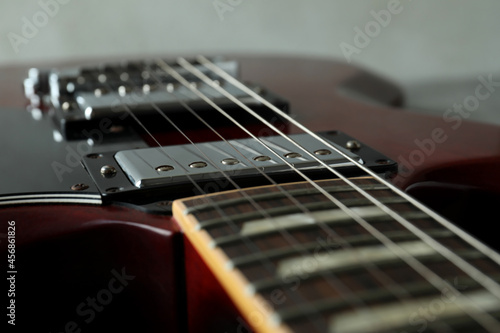 Red electric guitar, close up and selective focus
