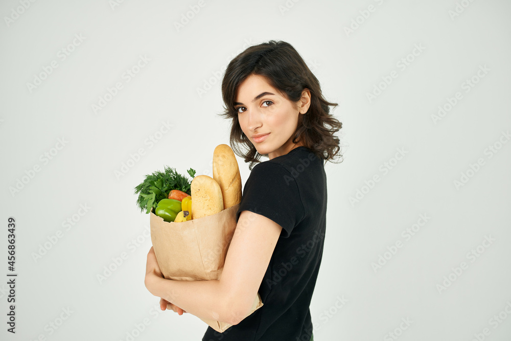 pretty woman with food package healthy food vegetables light background pretty woman with food package healthy food vegetables light background