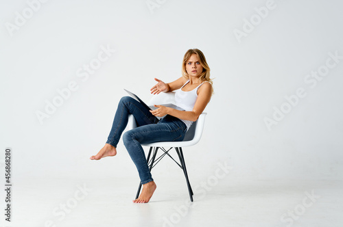 woman sitting on chair with laptop communication isolated background