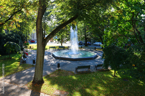 ANDRYCHOW, POLAND - SEPTEMBER 11, 2021: Beautiful fountain in city park in Andrychow, Poland. photo