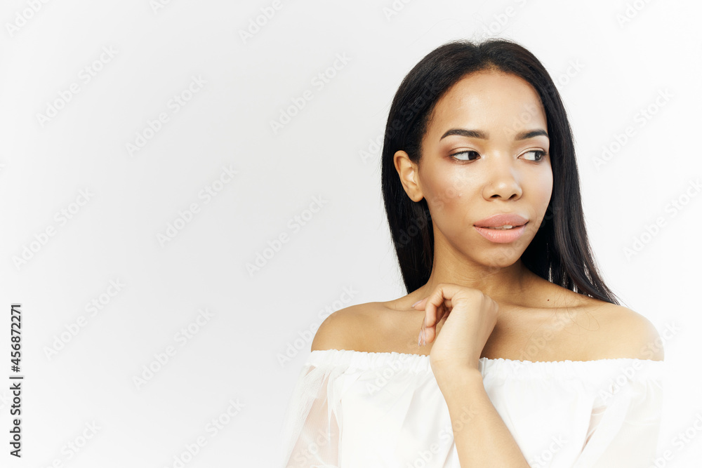 pretty woman in white dress african appearance posing fashion