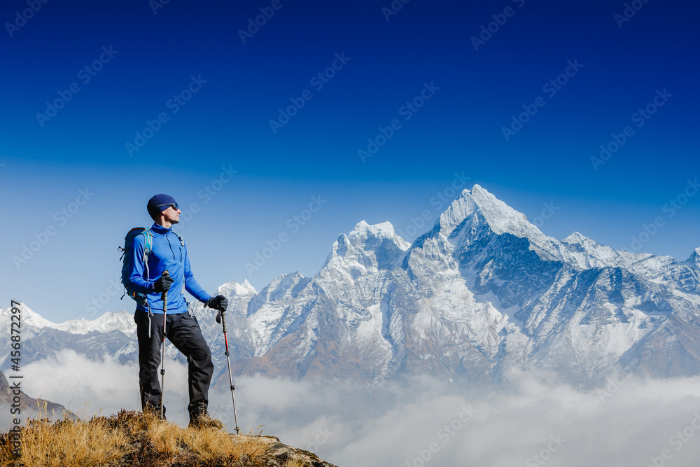 Hiker on the top in Himalayas mountains. Travel sport lifestyle concept. Everest base camp trek