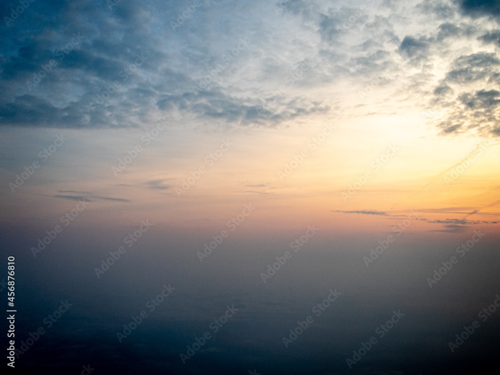 Sunrise view to sky and clouds from high altitude