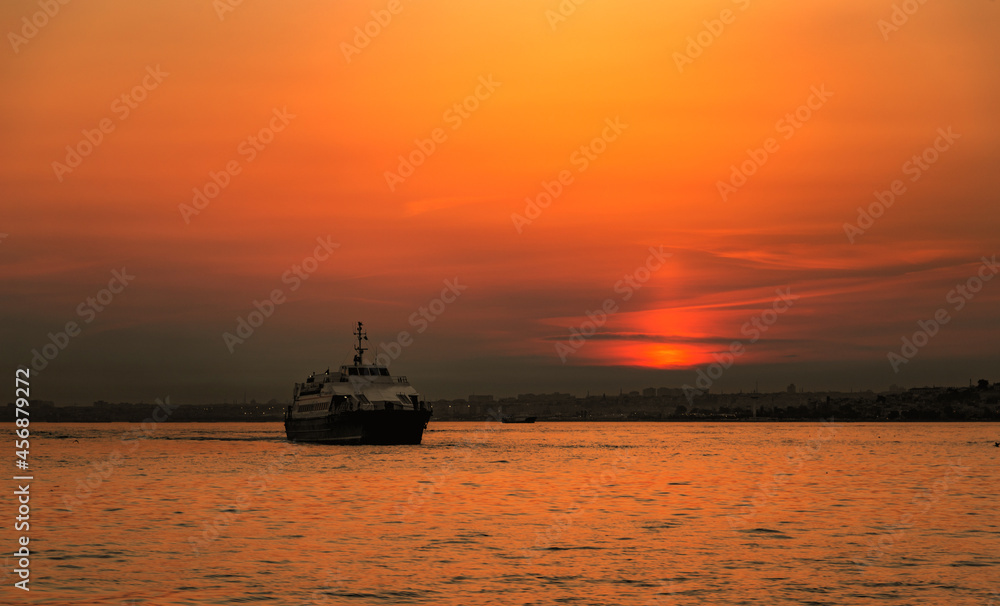 Ferry boat in Marmara sea near Istanbul coast. Sunset time