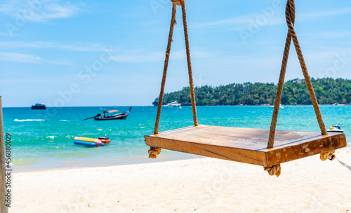 empty rope swing at summer beach day.Joy life freedom holidays for honeymoon concept