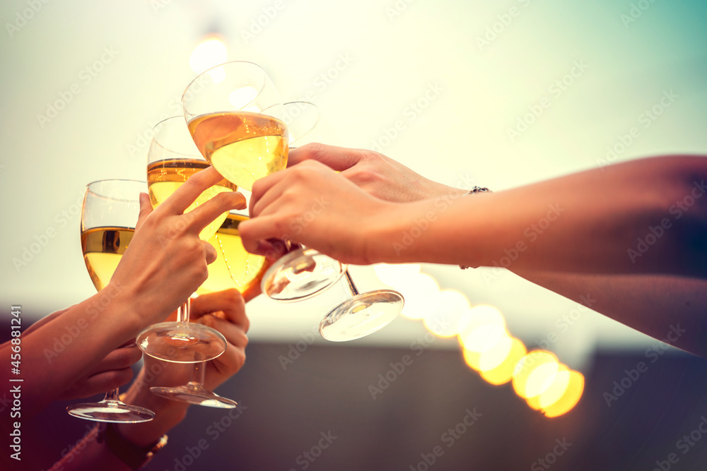 Party time start. Happy people toasting with champagne flutes. Multiethnic friends congratulating each other with new year. Celebration holiday concept, holiday background. selective focus Party time start. Happy people toasting with champagne flutes. Multiethnic friends congratulating each other with new year. Celebration holiday concept, holiday background. selective focus