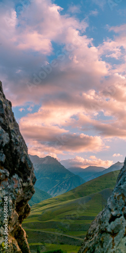 Mountains of North Ossetia, beautiful summer landscapes with blue sky and clouds. Vertical format. photo