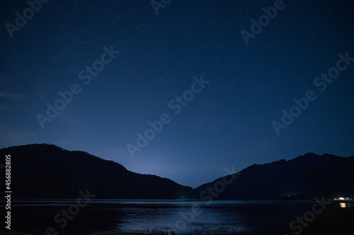 Mountain silhouette and starry sky