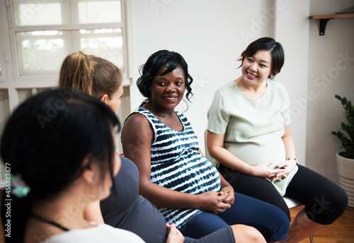 Pregnant women in a class photo