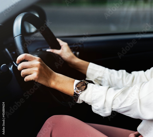 Woman driving a car on a road