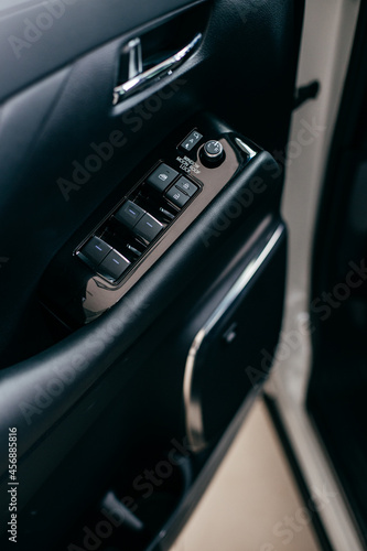 Car interior detail. Closeup of controls on the door © Hanna